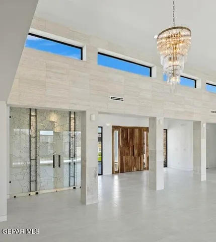 a spacious bathroom with a double vanity sink and a mirror