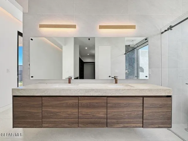 a view of an empty room with a cabinet