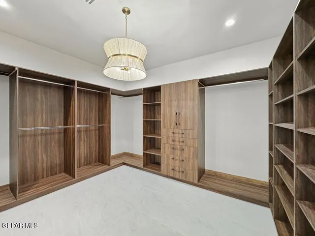 a bathroom with a granite countertop sink toilet a mirror a vanity and shower