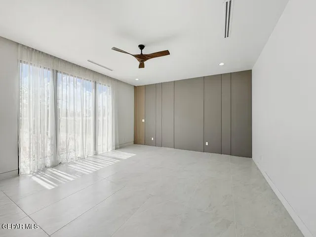 a bathroom with a shower and a window