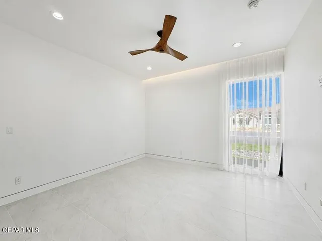 a bathroom with a sink shower and a mirror