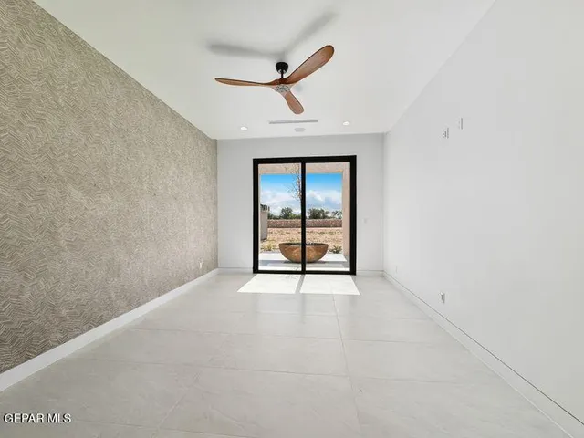 a kitchen with stainless steel appliances kitchen island wooden cabinets and a stove top oven