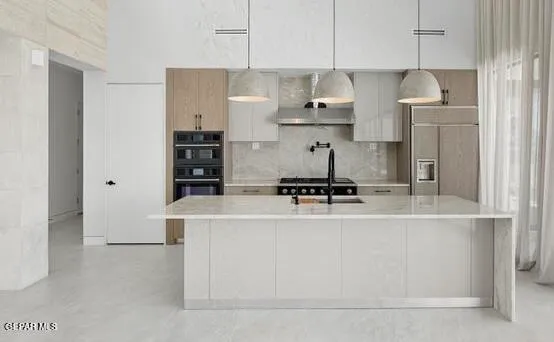 a kitchen with stainless steel appliances white cabinets and stove