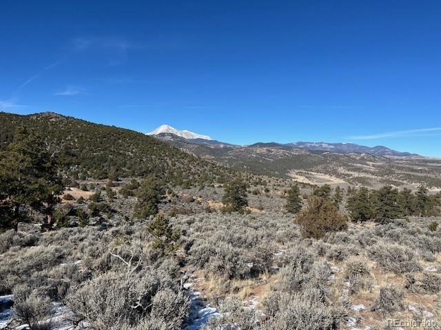 Lot 4554 Clausen Road Fort Garland, CO 81133 - Photo 8 of 30 a view of a mountain in the distance in a field