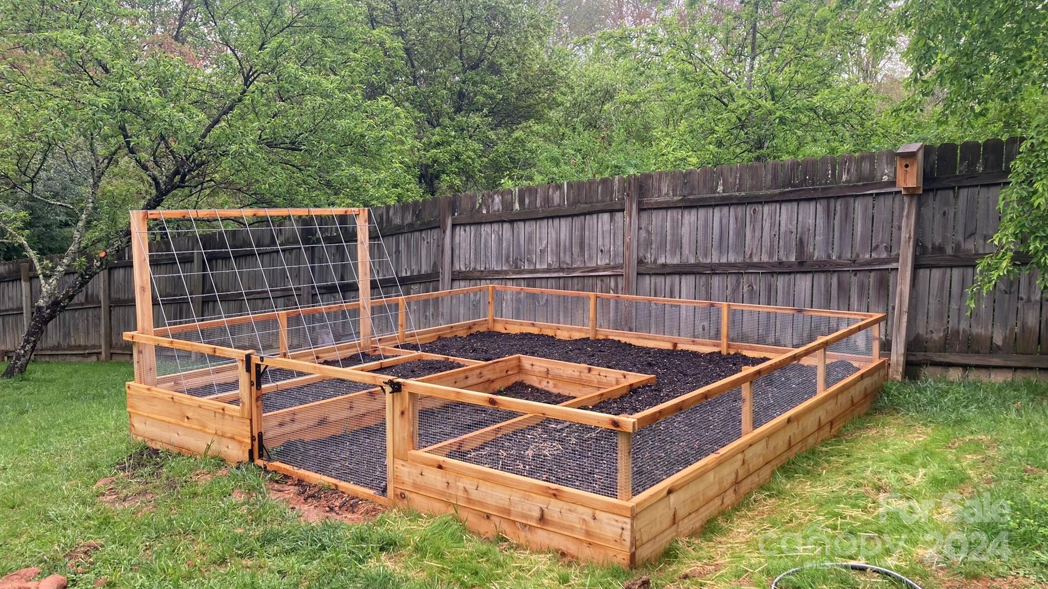 307 Tabernacle Road Black Mountain, NC 28711 - Photo 23 of 27 a view of a backyard with a small pool and sitting area