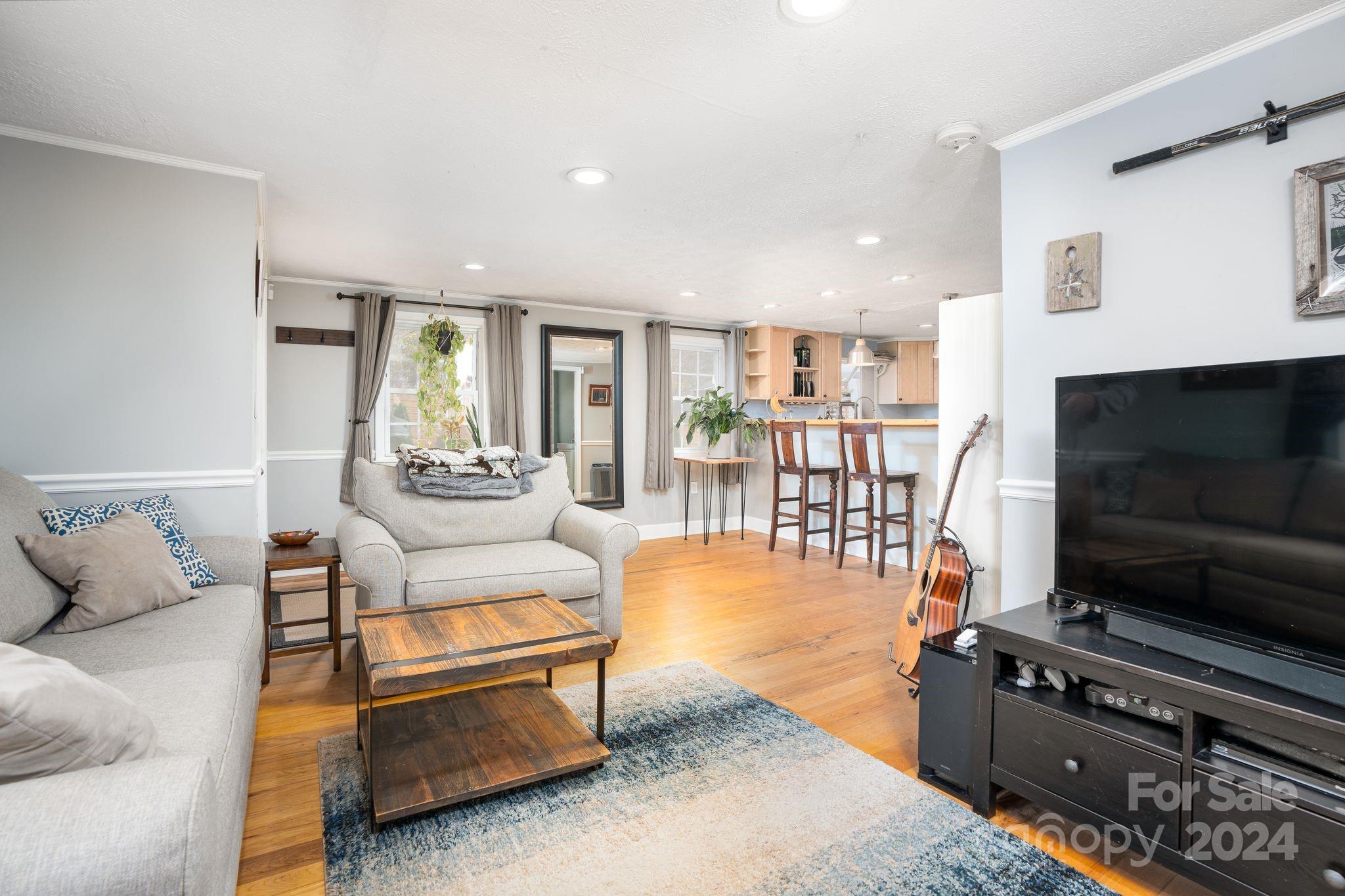 307 Tabernacle Road Black Mountain, NC 28711 - Photo 4 of 27 a living room with furniture and a flat screen tv