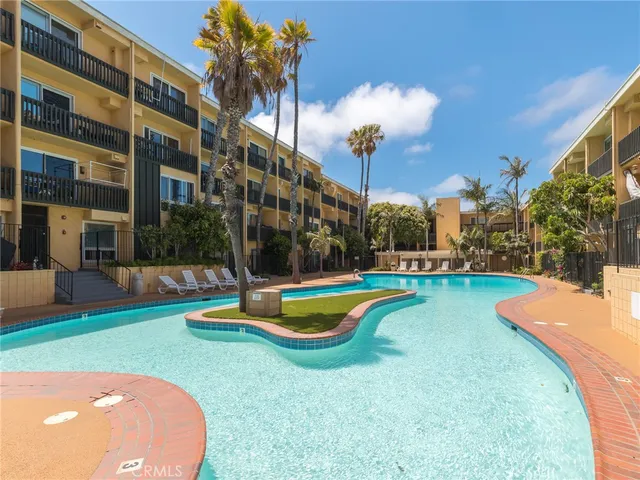 a view of a house with swimming pool and yard