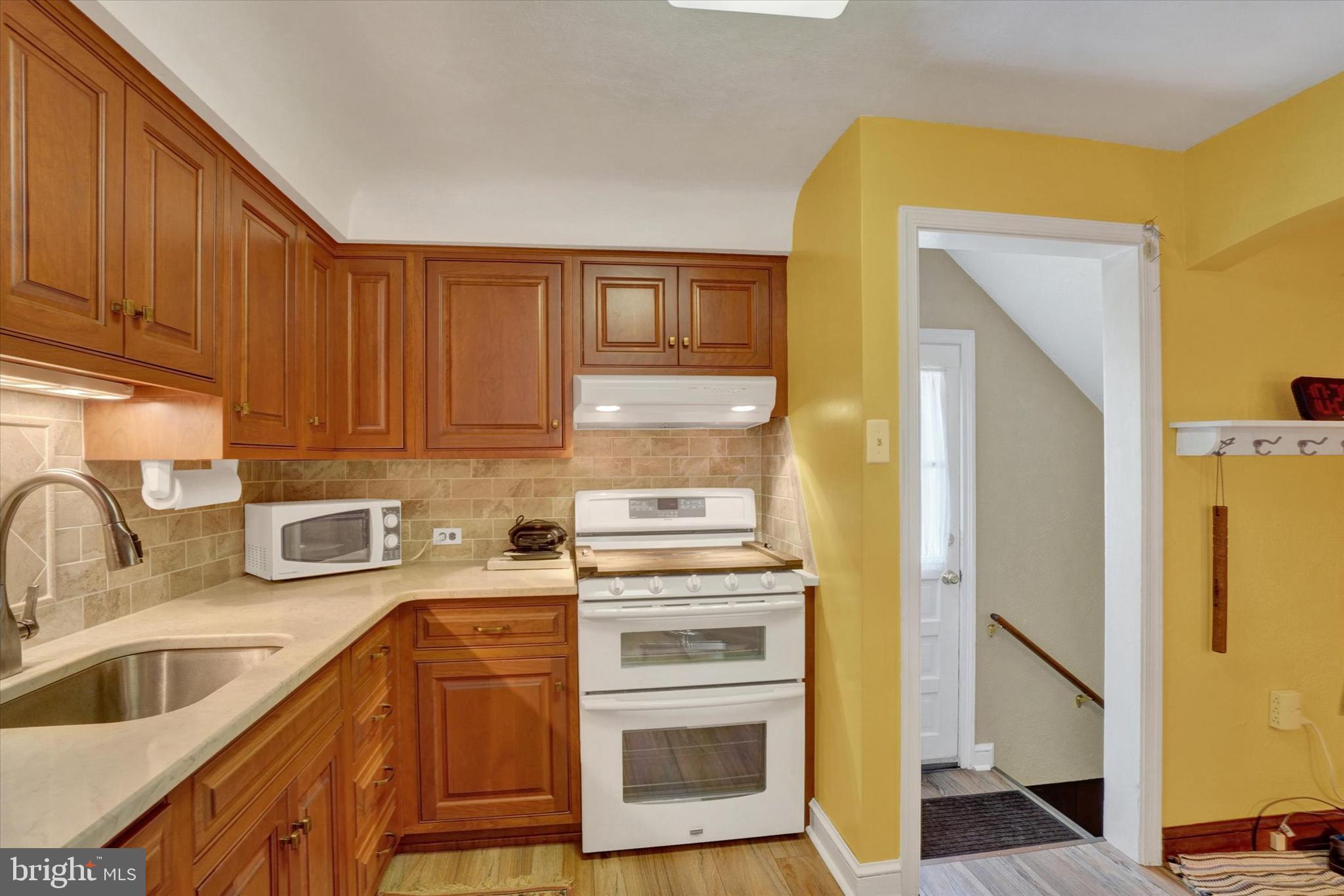 428 Edgehill Road York, PA 17403 - Photo 13 of 27 a kitchen with stainless steel appliances granite countertop a sink a stove and refrigerator