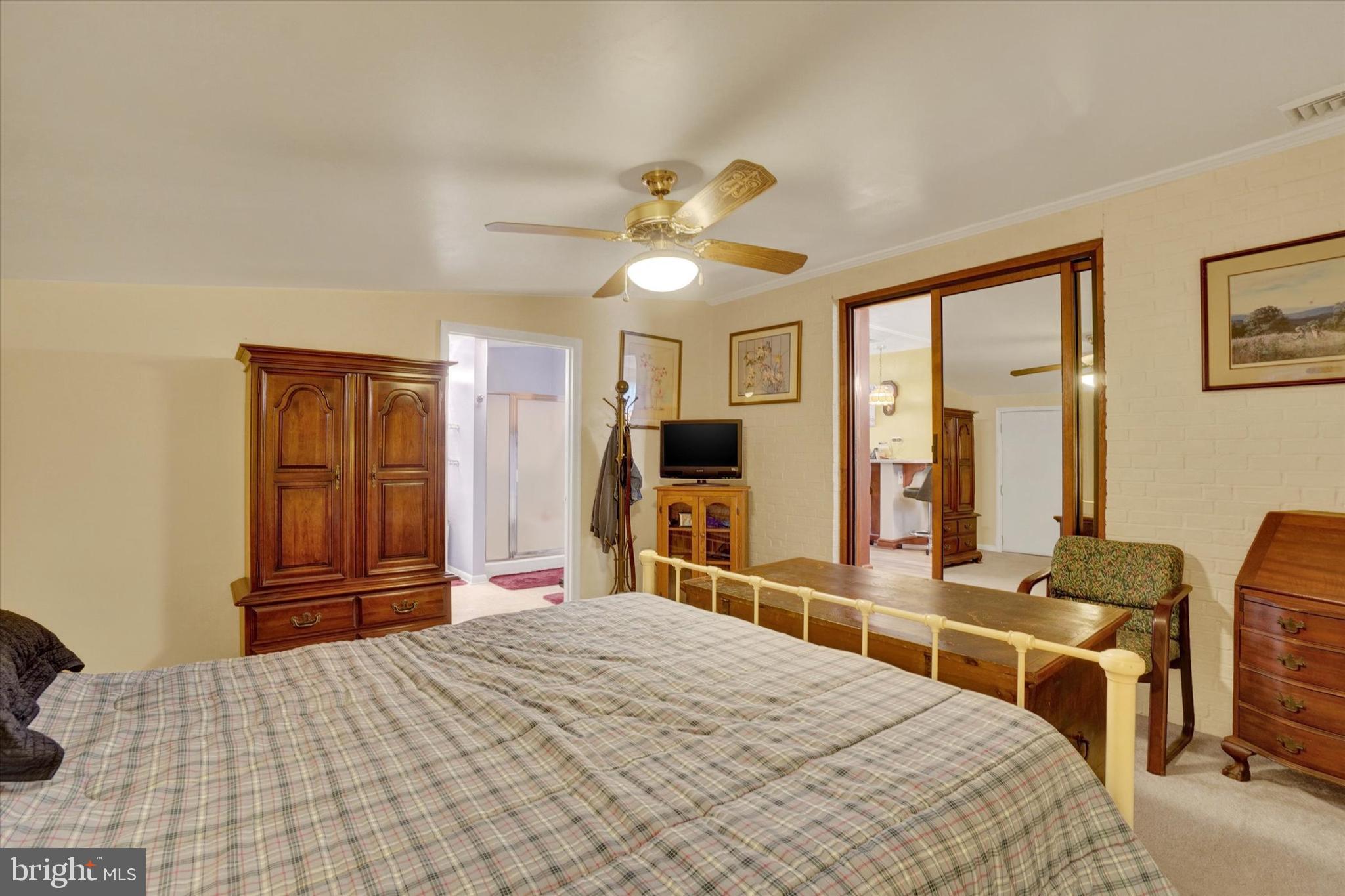 428 Edgehill Road York, PA 17403 - Photo 15 of 27 a bedroom with a bed and a chandelier