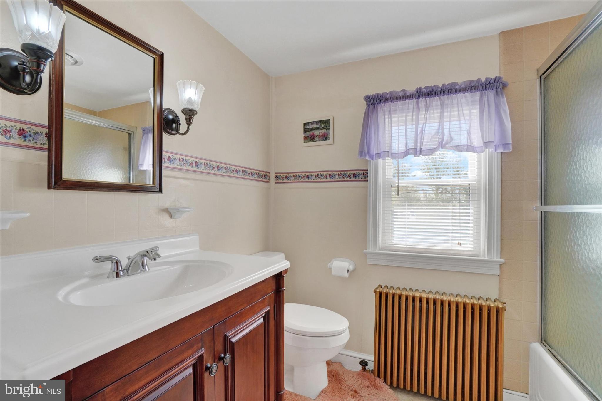 428 Edgehill Road York, PA 17403 - Photo 18 of 27 a bathroom with a sink vanity granite toilet and a mirror