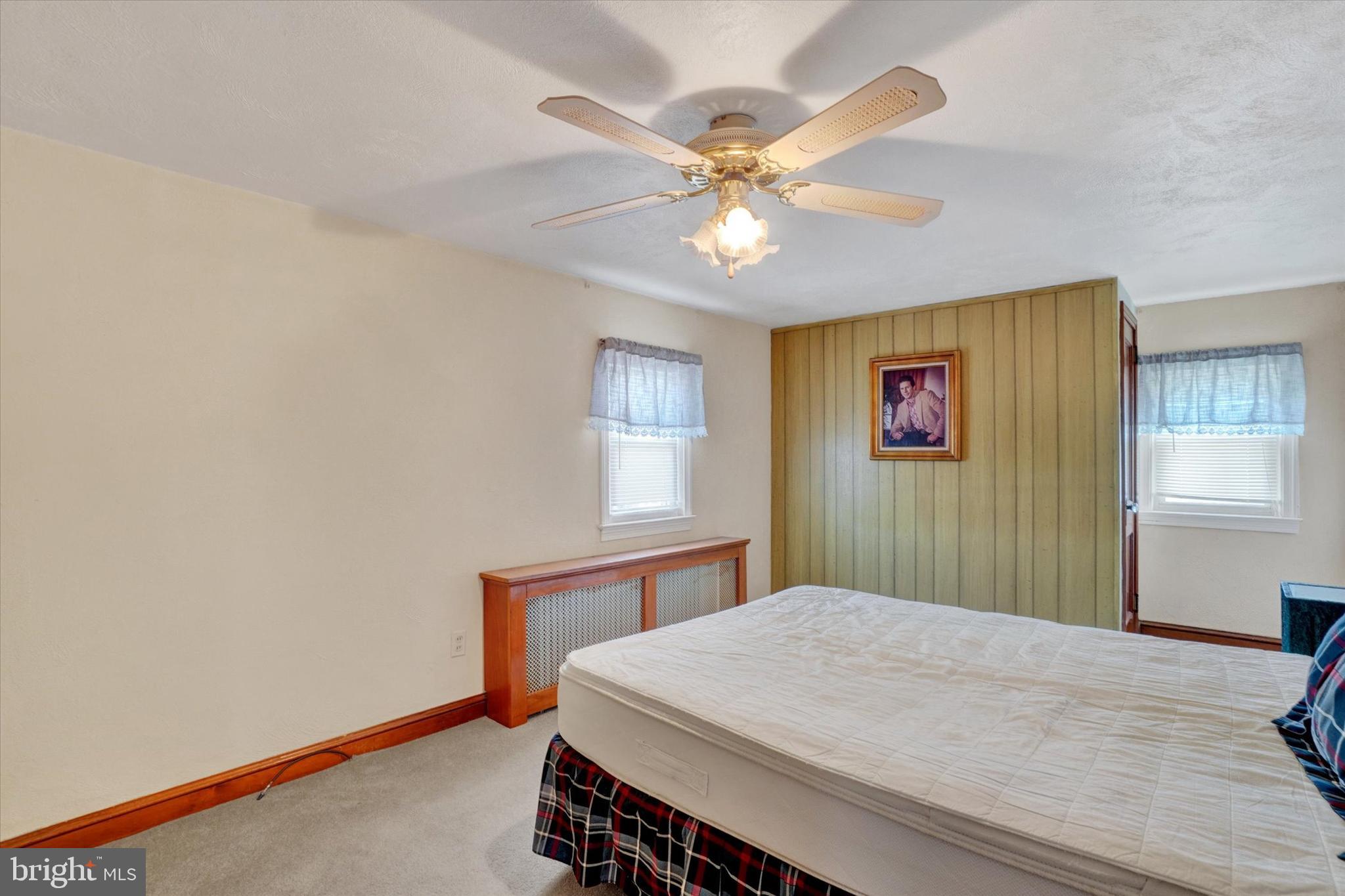 428 Edgehill Road York, PA 17403 - Photo 20 of 27 a bedroom with a bed and a chandelier