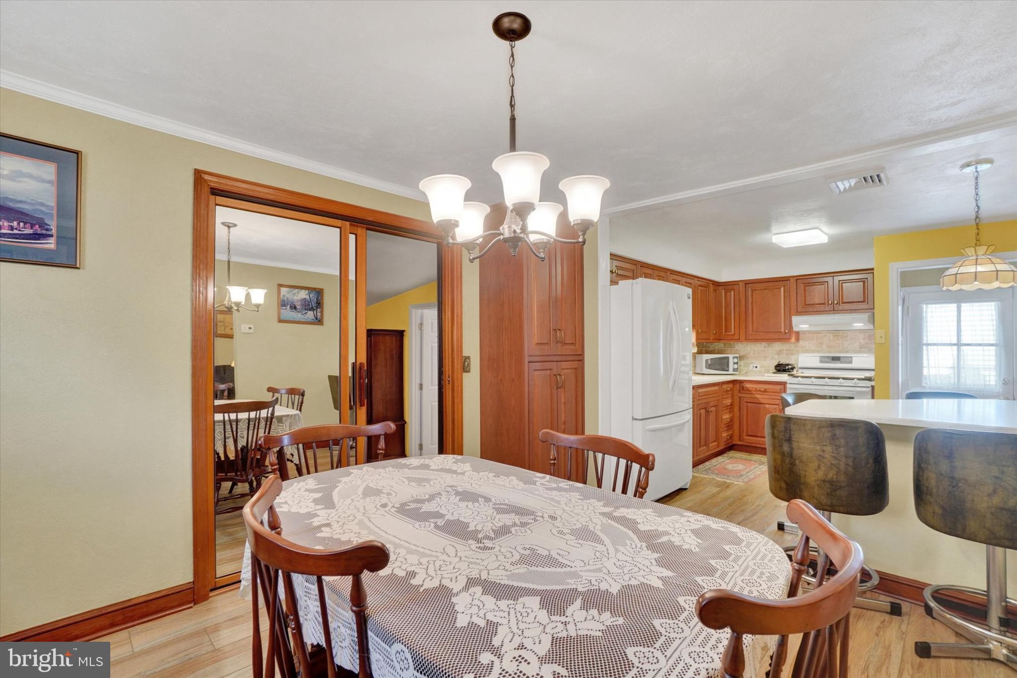 428 Edgehill Road York, PA 17403 - Photo 8 of 27 a dining room filled chandelier and wooden floor