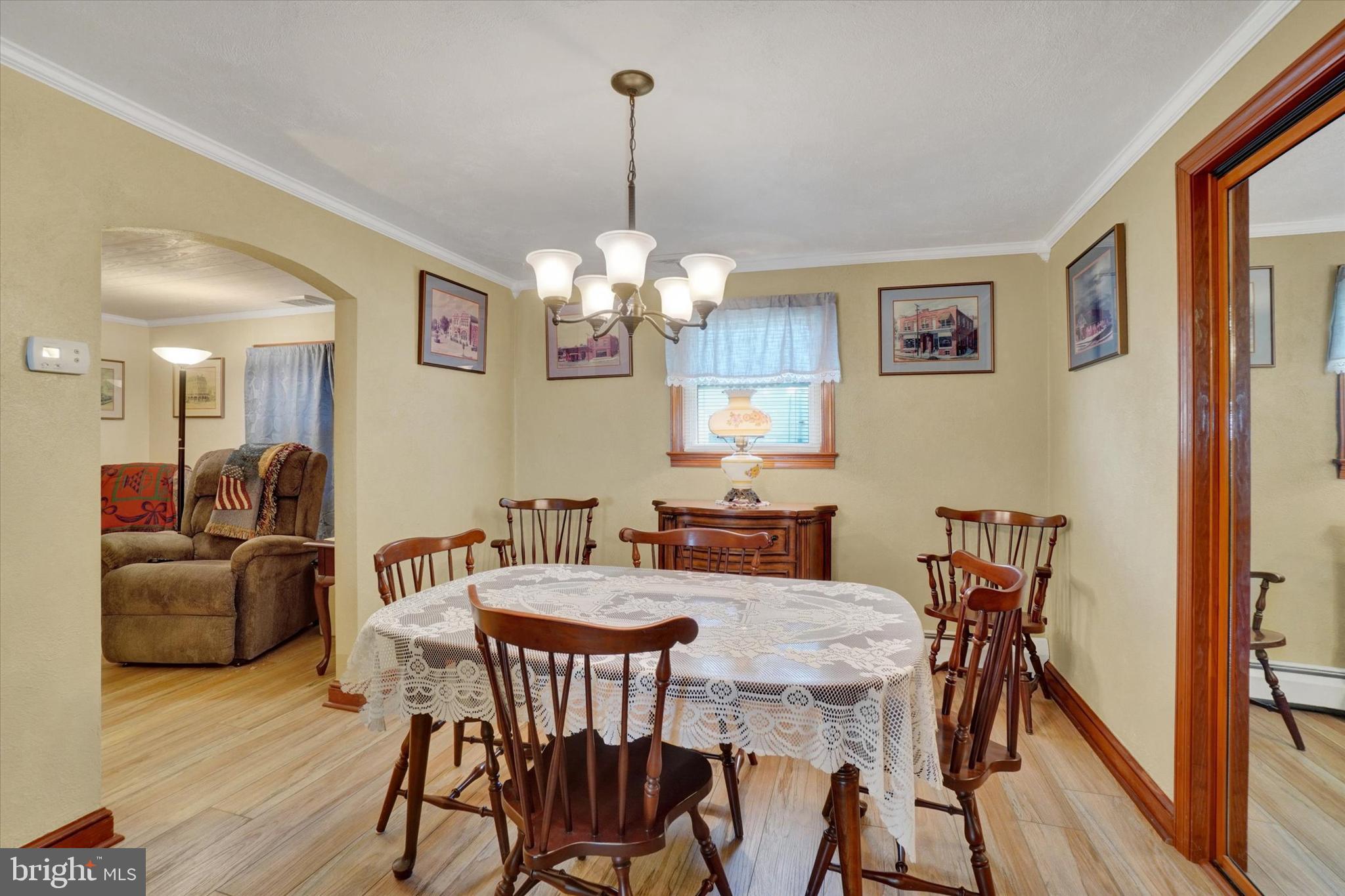 428 Edgehill Road York, PA 17403 - Photo 9 of 27 a view of a dining room with furniture wooden floor and chandelier