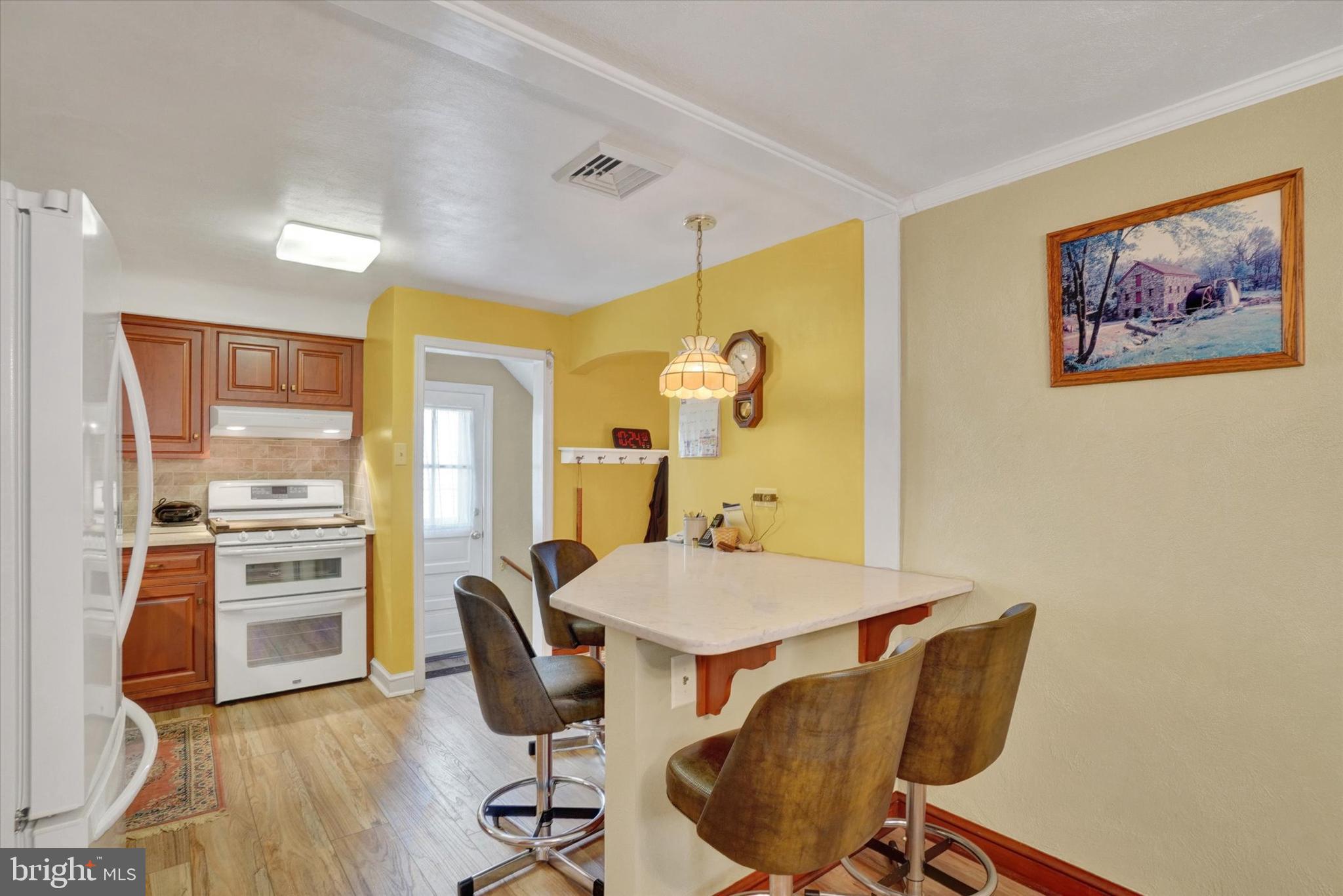 428 Edgehill Road York, PA 17403 - Photo 10 of 27 a view of a dining room with furniture and wooden floor