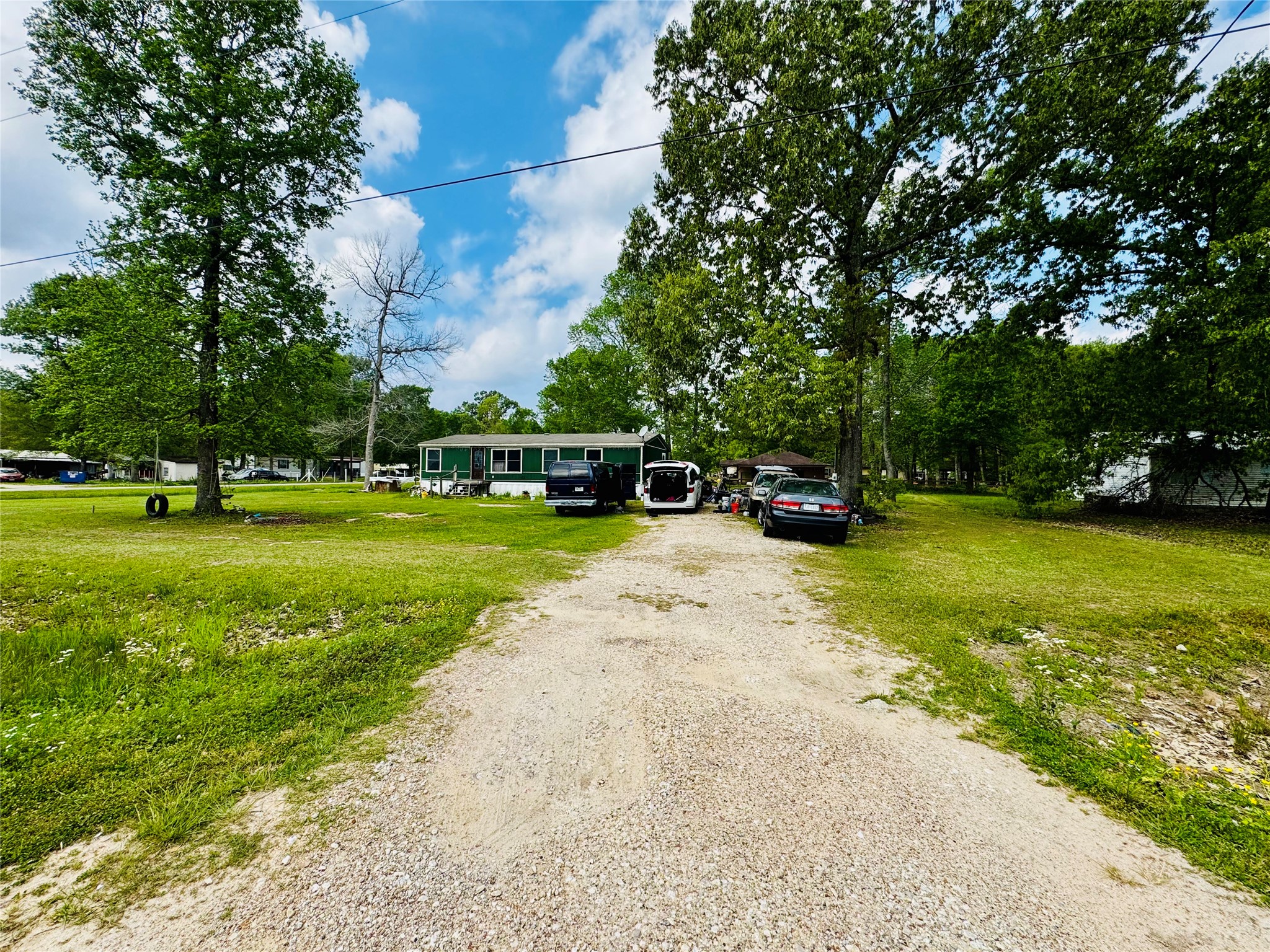 151 County Road 2801 Cleveland, TX 77327 - Photo 2 of 4 a view of a park with large trees