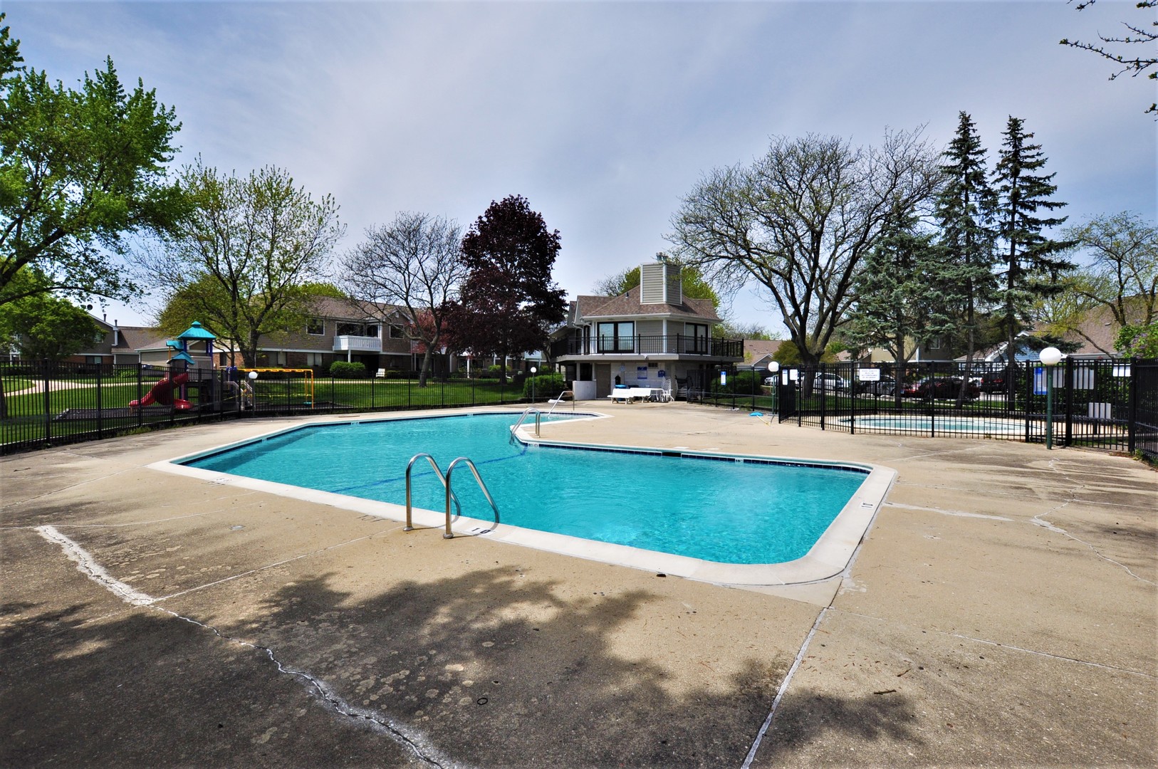 216 Deerpath Court, Unit D1 Schaumburg, IL 60193 - Photo 14 of 16 a swimming pool with outdoor seating and yard