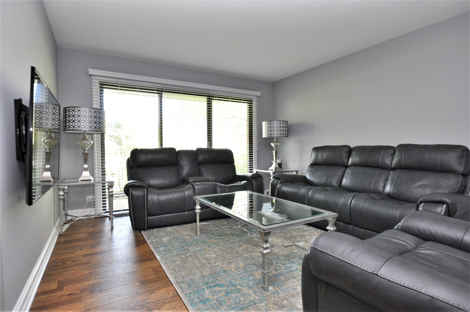 216 Deerpath Court, Unit D1 Schaumburg, IL 60193 - Photo 5 of 16 a living room with furniture and a flat screen tv