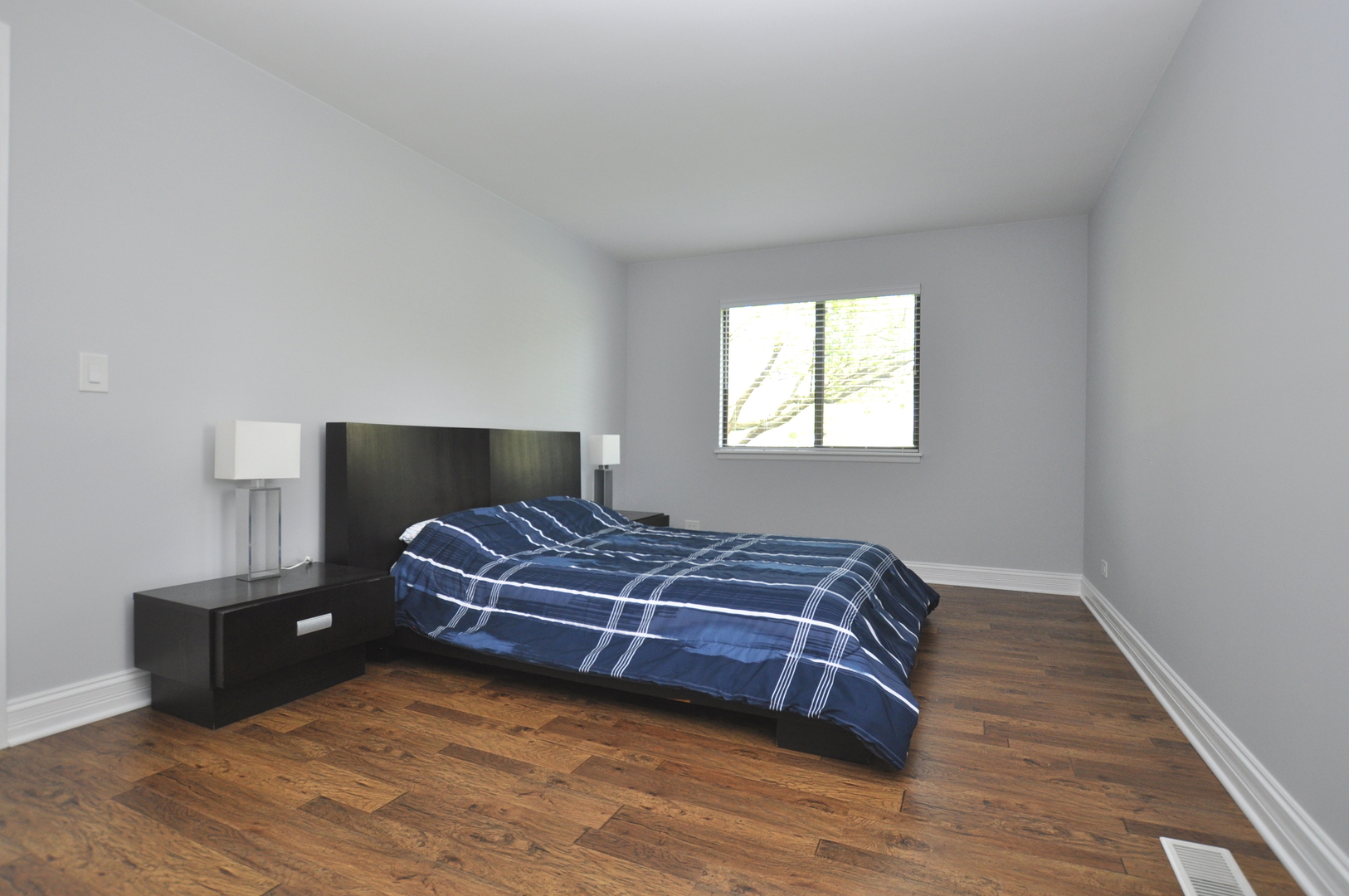 216 Deerpath Court, Unit D1 Schaumburg, IL 60193 - Photo 8 of 16 a bedroom with a bed and window