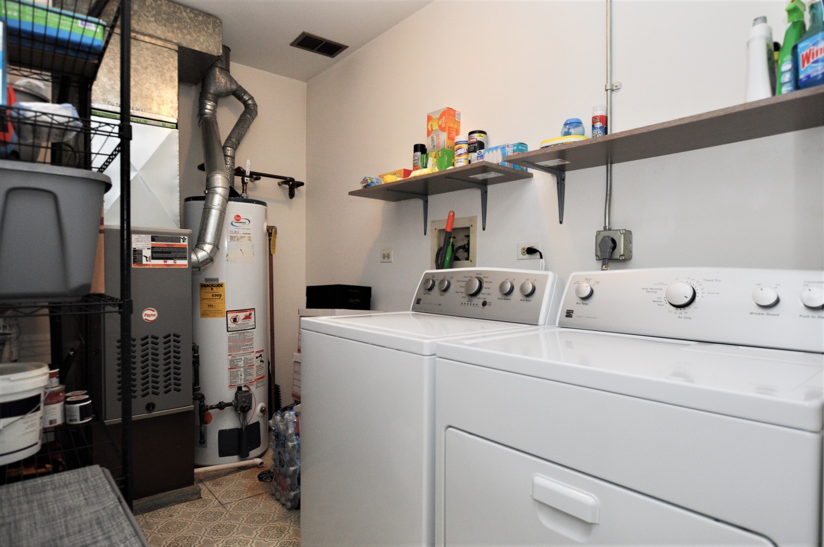 216 Deerpath Court, Unit D1 Schaumburg, IL 60193 - Photo 10 of 16 a utility room with dryer and washer