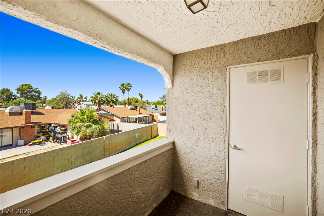 3311 Sunfish Drive, Unit D Henderson, NV 89014 - Photo 16 of 21 Unwind on the private balcony offering panoramic neighborhood views and ample outdoor storage.