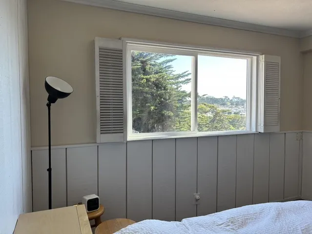 a bedroom with a bed and closet