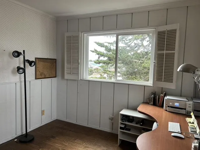 a workspace with furniture and a window