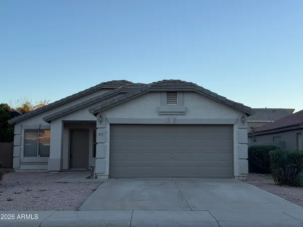 a front view of a house with garage