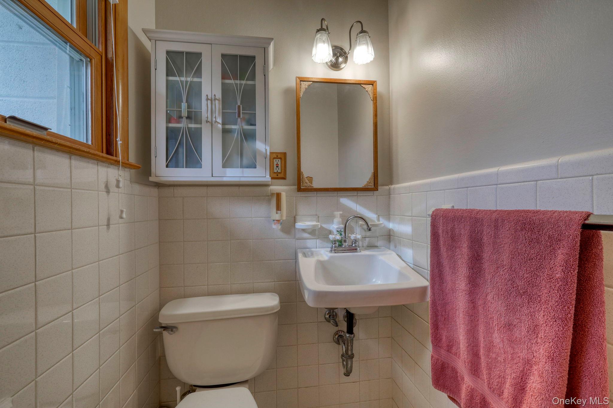 4 Irene Court Fishkill, NY 12524 - Photo 16 of 46 a bathroom with a toilet sink and mirror