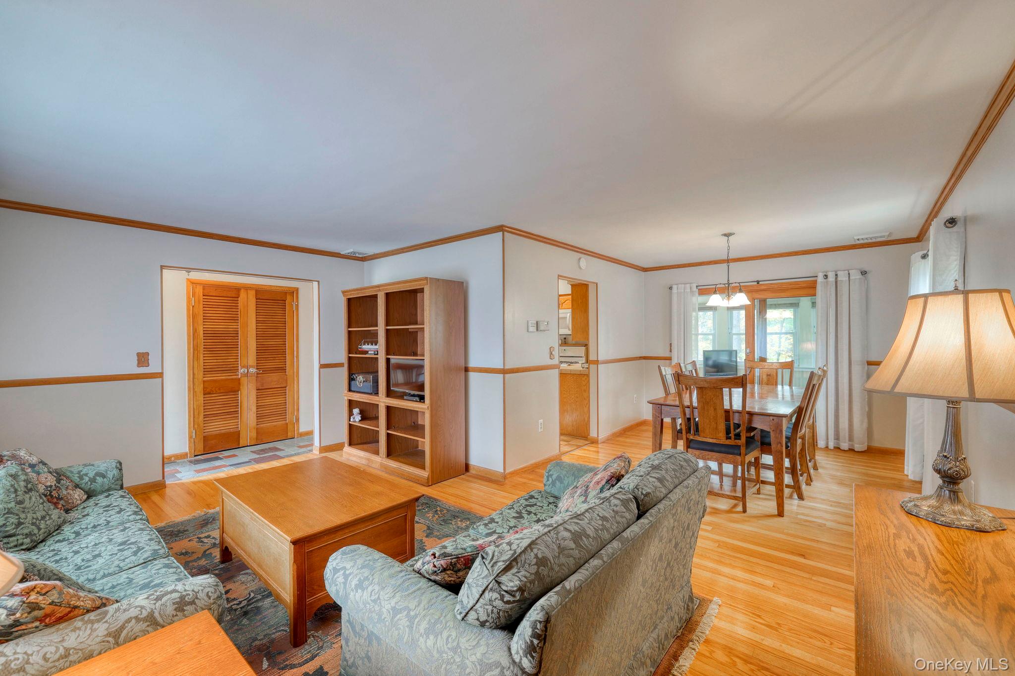 4 Irene Court Fishkill, NY 12524 - Photo 2 of 46 a living room with furniture a table and chairs with wooden floor
