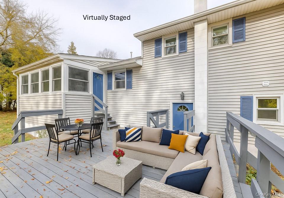 4 Irene Court Fishkill, NY 12524 - Photo 3 of 46 a view of a patio with couches table and chairs and wooden floor