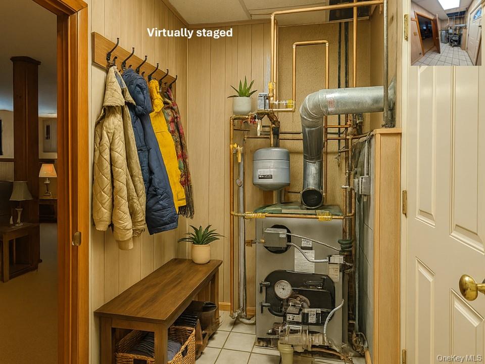 4 Irene Court Fishkill, NY 12524 - Photo 35 of 47 Virtually staged Mudroom with wood walls, a heating unit, and light tile patterned flooring