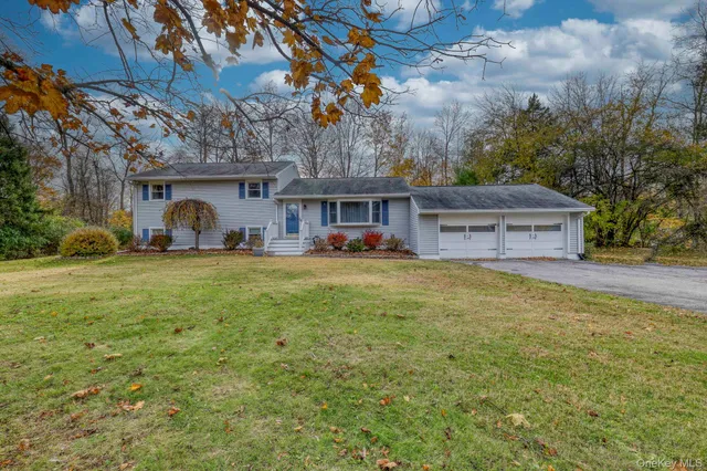 a front view of a house with yard