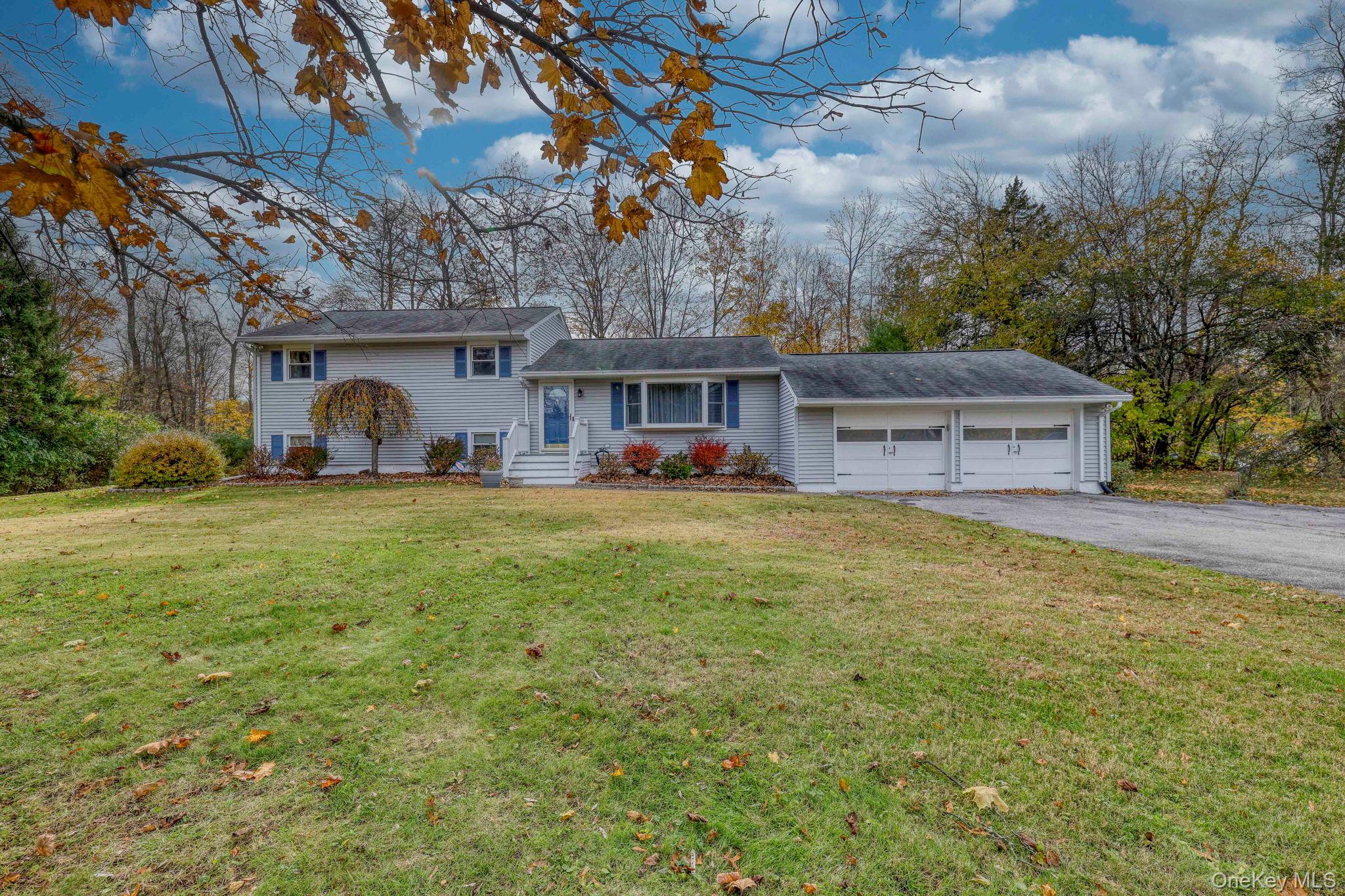4 Irene Court Fishkill, NY 12524 - Photo 44 of 46 Tri-level home featuring a front yard, asphalt driveway, and an attached garage