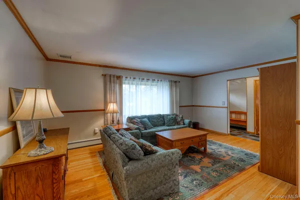 a living room with furniture and a window