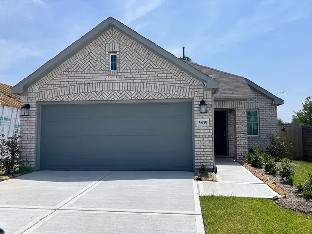 a front view of house with garage