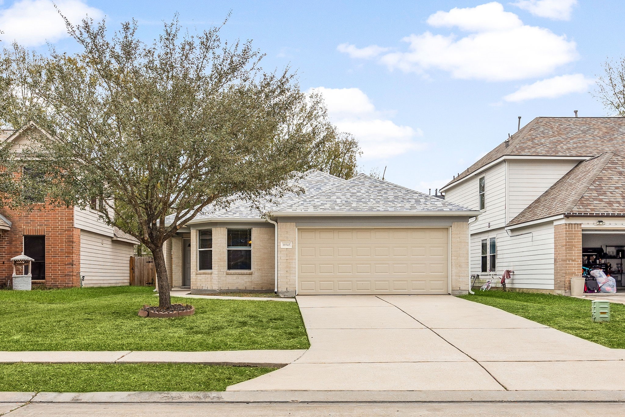 a front view of a house with a garden