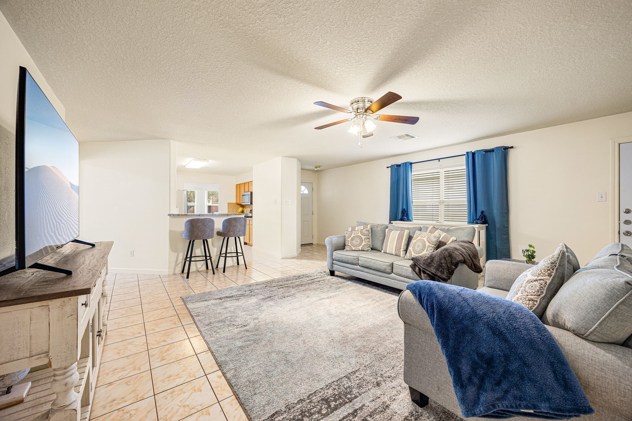 16945 Scenic Knoll Conroe, TX 77385 - Photo 11 of 39 a living room with furniture and a flat screen tv