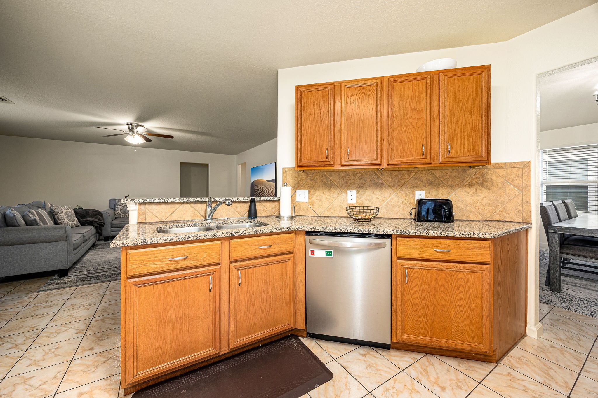 16945 Scenic Knoll Conroe, TX 77385 - Photo 13 of 39 a kitchen with stainless steel appliances granite countertop a sink stove and cabinets