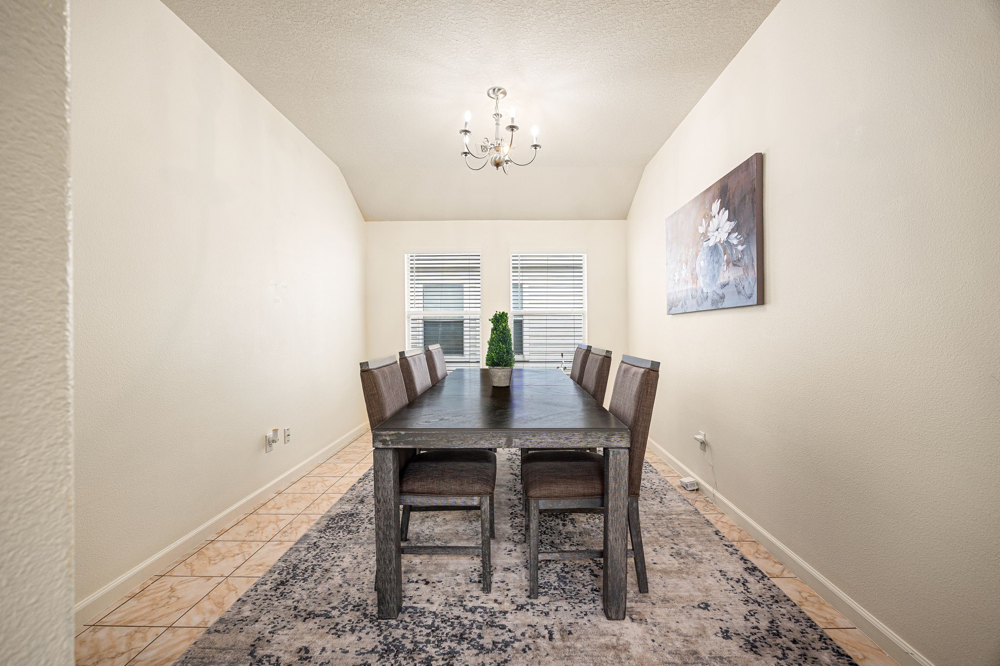 16945 Scenic Knoll Conroe, TX 77385 - Photo 19 of 39 a view of a dining room with furniture and a chandelier