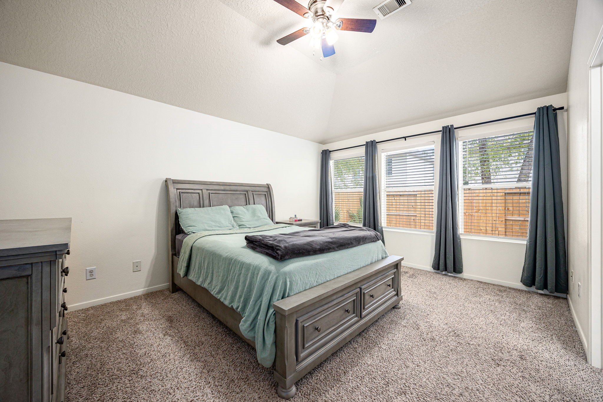 16945 Scenic Knoll Conroe, TX 77385 - Photo 21 of 39 a bedroom with a bed and window