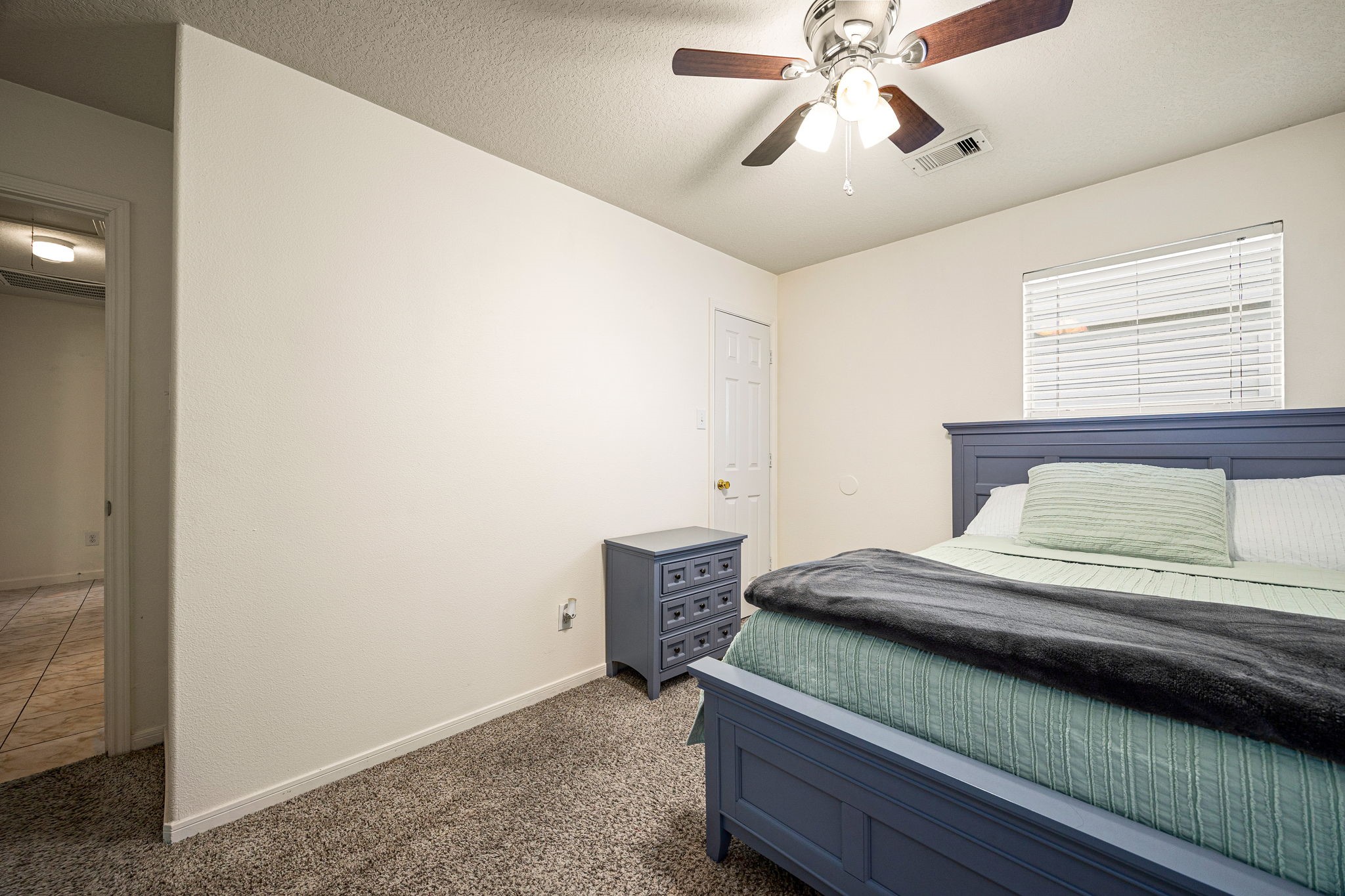 16945 Scenic Knoll Conroe, TX 77385 - Photo 22 of 39 a bedroom with a bed and window