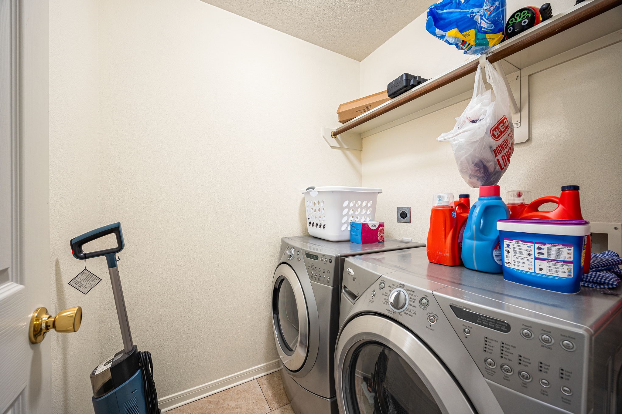 16945 Scenic Knoll Conroe, TX 77385 - Photo 30 of 39 a utility room with dryer and washer