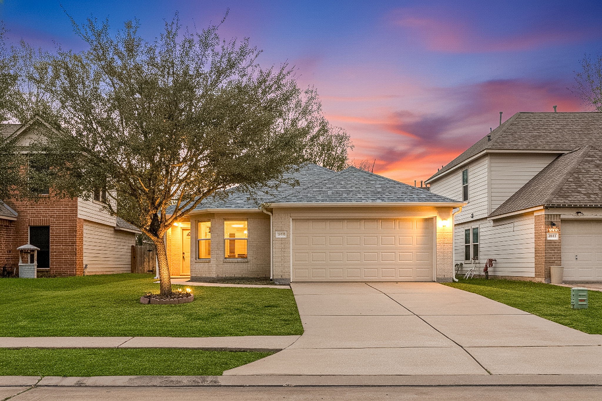 16945 Scenic Knoll Conroe, TX 77385 - Photo 37 of 39 a front view of a house with a garden and trees