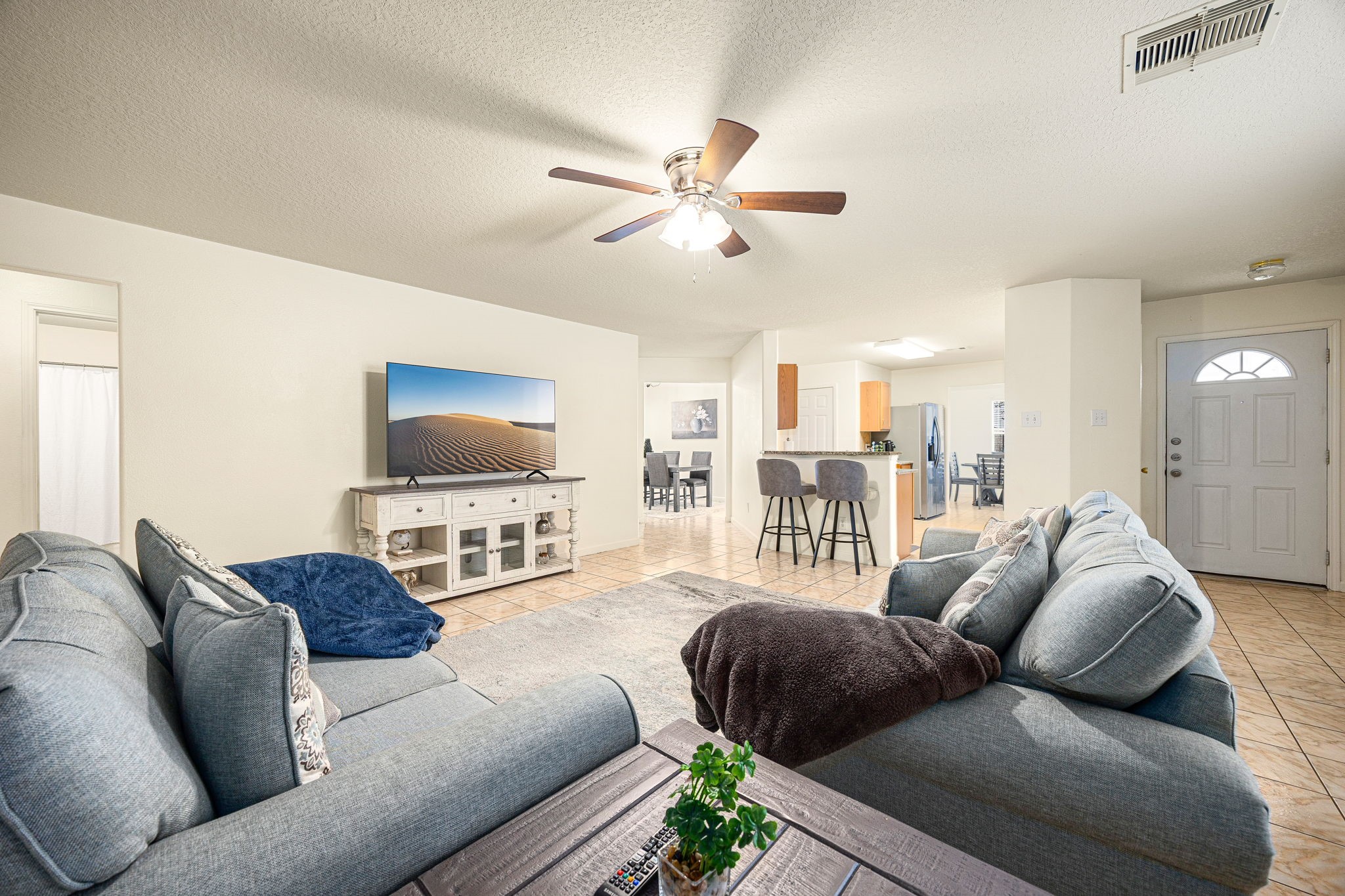 16945 Scenic Knoll Conroe, TX 77385 - Photo 10 of 39 a living room with furniture and a flat screen tv