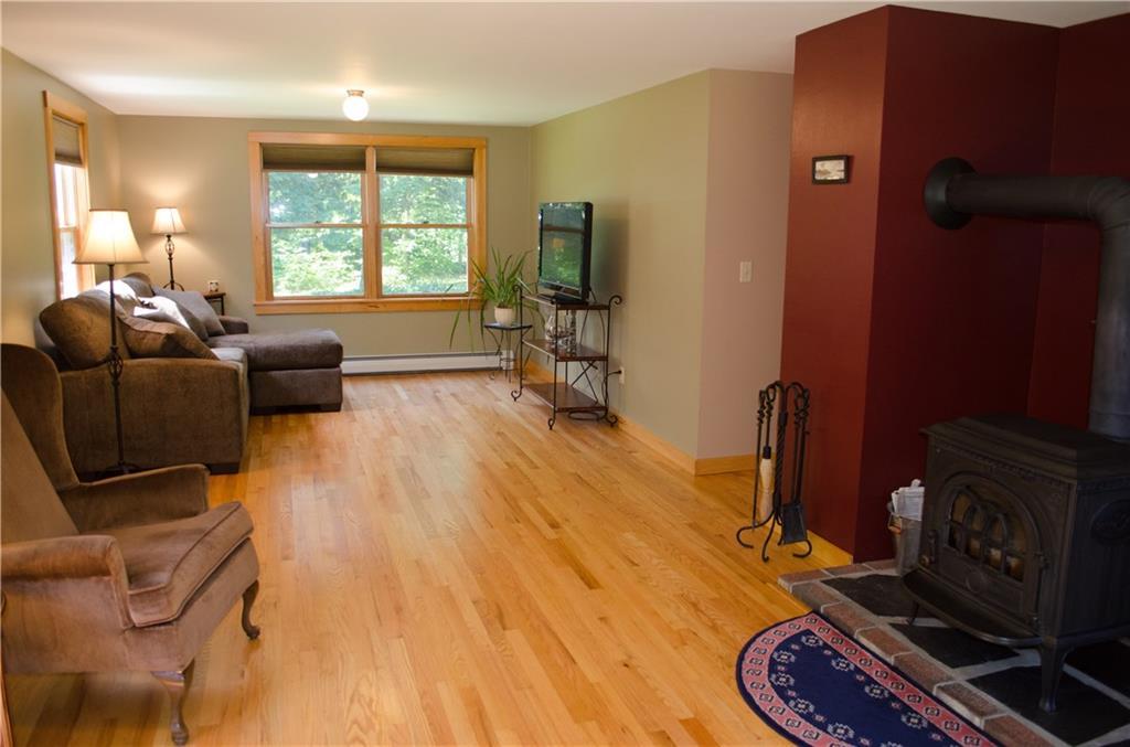 384 Plymouth Road Etna, ME 04434 - Photo 8 of 29 Large living room shows off the...