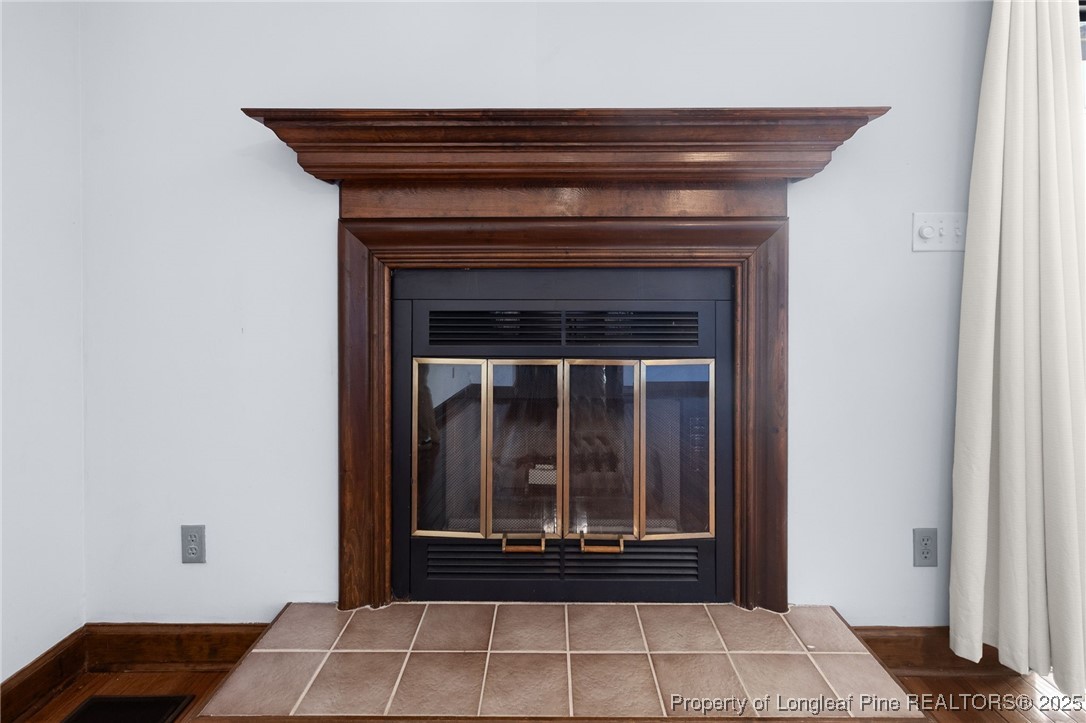484 Lands End Road Fayetteville, NC 28314 - Photo 19 of 41 a living room with a fireplace