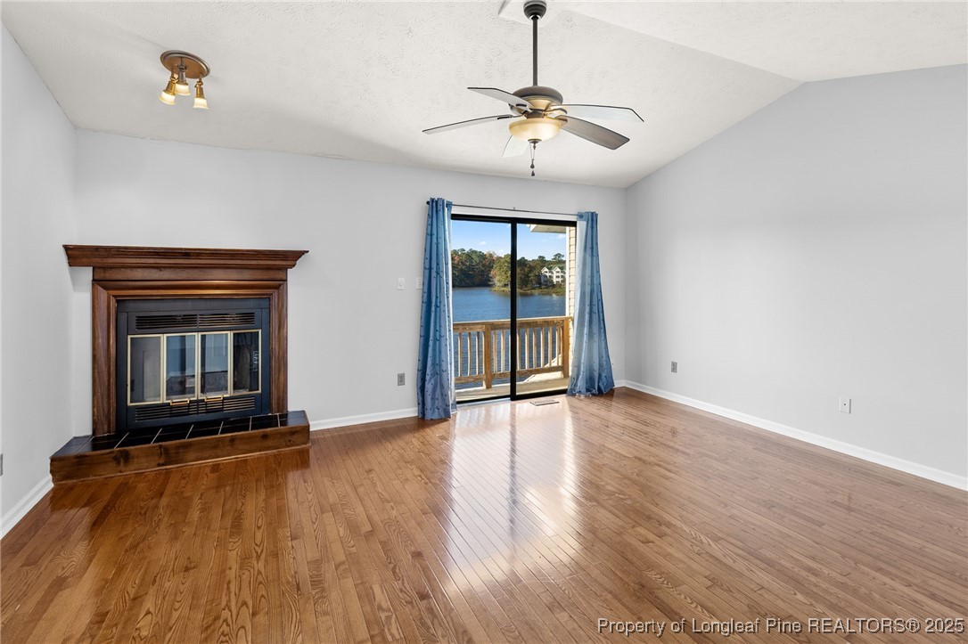 484 Lands End Road Fayetteville, NC 28314 - Photo 21 of 41 a view of an empty room with exposed radiator and fireplace