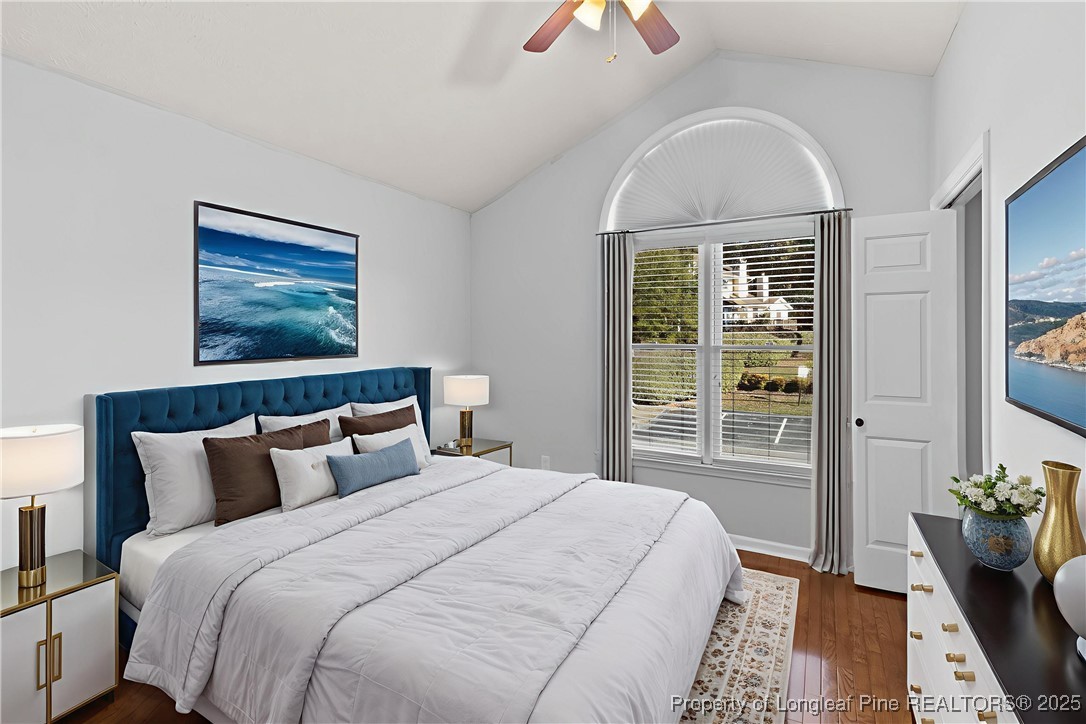 484 Lands End Road Fayetteville, NC 28314 - Photo 28 of 41 a bedroom with a large bed and a chandelier