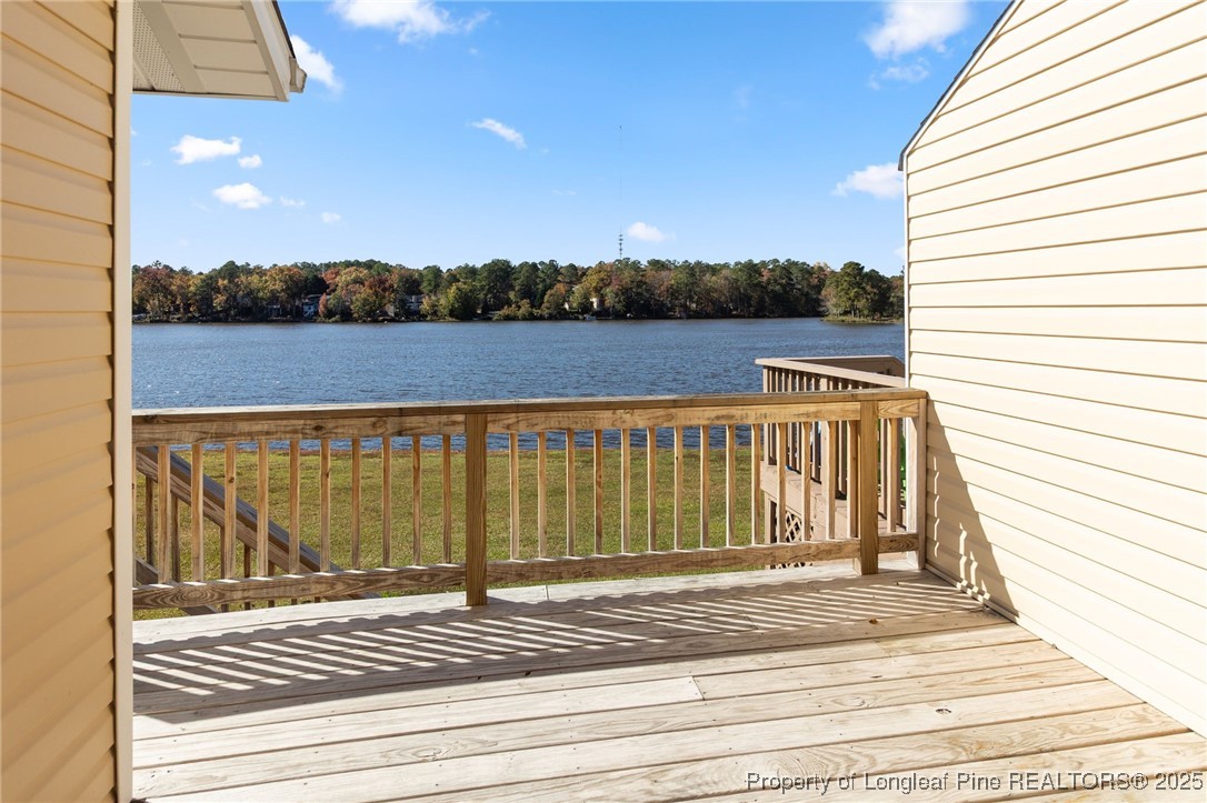 484 Lands End Road Fayetteville, NC 28314 - Photo 33 of 41 a view of a balcony with wooden floor and lake view