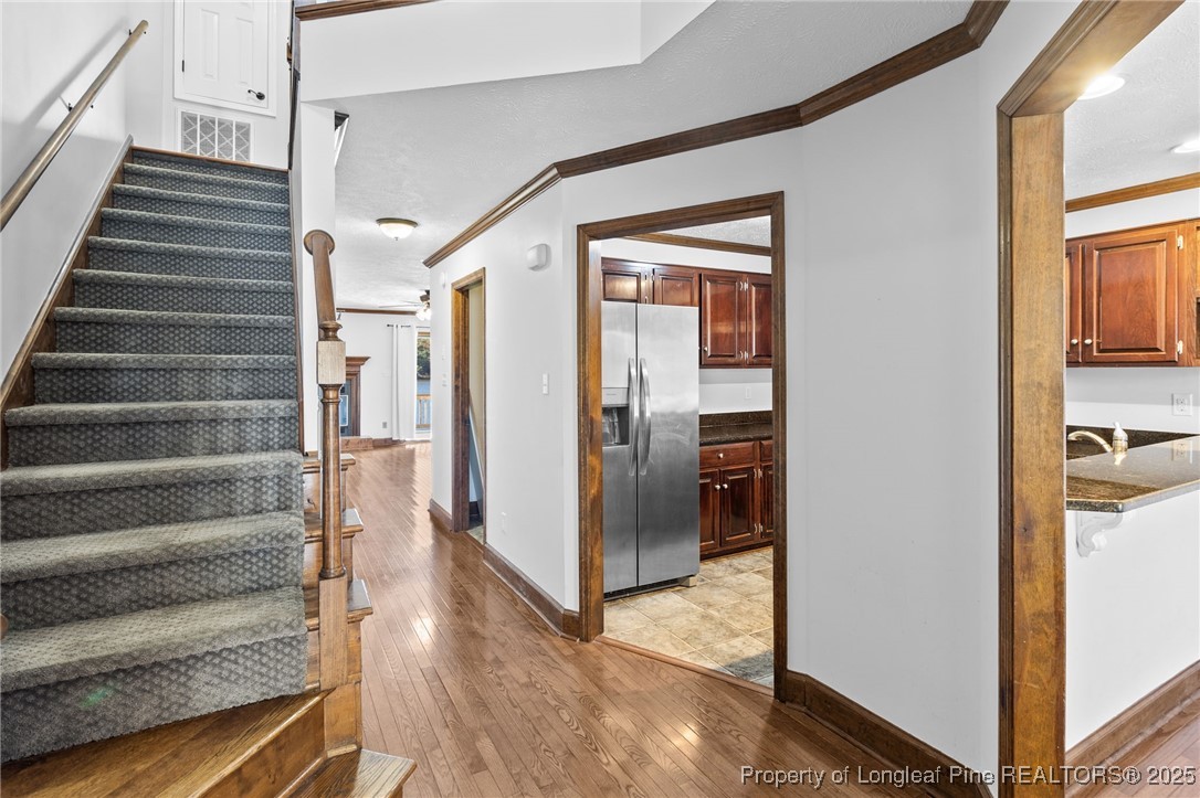 484 Lands End Road Fayetteville, NC 28314 - Photo 7 of 41 a view of a hallway with wooden floor and entryway
